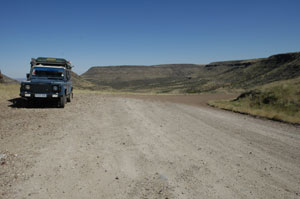 gravel road heading inland from the coast